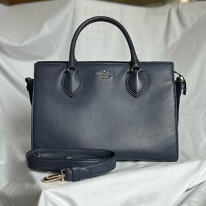 Genuine leather satchel/shoulder/crossbody bag. Center divided zipper pocket.